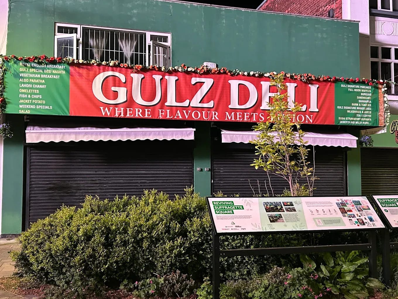 The Gulz Deli shopfront lit up on Brown Street